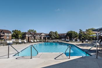 Our apartments have a resort style pool with chairs around it